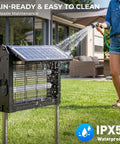 Top Notch Dual Solar Powered Bug Zapper Outdoor Cordless Mosquito Killer 4500V Waterproof being rinsed with water in a patio