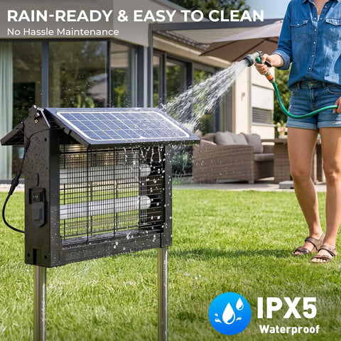 Top Notch Dual Solar Powered Bug Zapper Outdoor Cordless Mosquito Killer 4500V Waterproof being rinsed with water in a patio