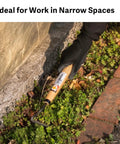 Person using Compact Hand Weeding Sickle For Quick Surface Weed Removal In Narrow Beds And Tight Spaces, Twisted Blade Scrapes Just Below The Soil Surface For Fast Garden Cleanup And Light Grass Cutting in a garden bed