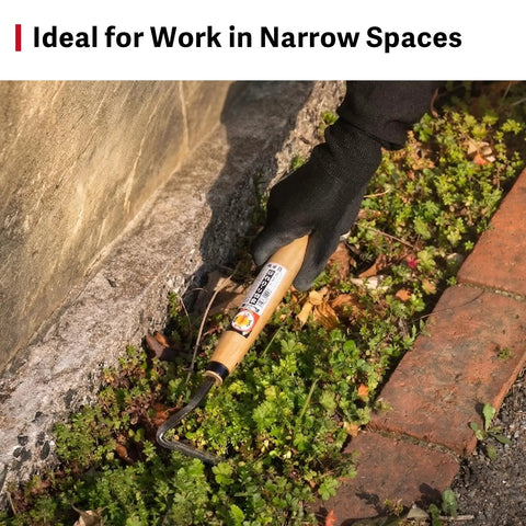 Person using Compact Hand Weeding Sickle For Quick Surface Weed Removal In Narrow Beds And Tight Spaces, Twisted Blade Scrapes Just Below The Soil Surface For Fast Garden Cleanup And Light Grass Cutting in a garden bed
