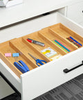 Expandable Bamboo Drawer Organizer For Kitchen Utensils And Flatware Adjustable Cutlery Tray And Knife Organizer Drawer Divider With Five Slots Fits Large Or Small Drawers Go To Kitchen Must Have Home Organizer installed in white drawer with office supplies.