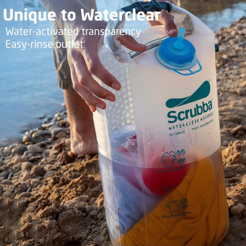 Pocket Sized Portable Travel Wash Bag Featuring Patented Washboard Design Ultra Lightweight Foldable Clothes Cleaner, rinsing clothes by the water.