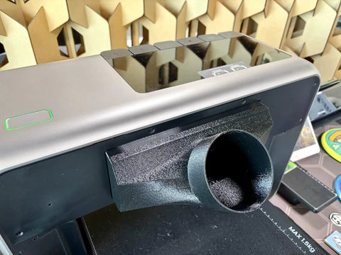 4-Inch Odor Eliminator Adapter Fume Extractor for E1 UV Printer in black PETG at workshop setup