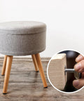 Wooden stool with metal threaded furniture foot leveler being adjusted, 20Pcs 5 By 16 Inch Threaded Furniture Feet Levelers set shown