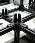 Awesome V Slot Aluminum Corner Brackets For 20 Series Extrusion Frames in black connecting metal frames on a workbench.