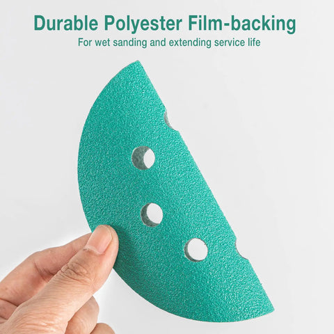 Close-up of a hand holding a 5-Inch 8-Hole Wet Dry Sanding Discs 1000 Grit Polyester Film Backed Heavy-Duty Hook And Loop Sandpaper