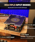 Beefy 440W Dual Channel Audio Amplifier Board with Bluetooth 5.2, AUX inputs, and dual TPA3251 chips on a wooden table.
