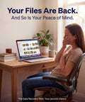 Woman at desk happily viewing recovered files on laptop, using One Click Data Recovery Stick For Windows Lets You Recover Deleted Photos Videos And Files From USB Drives And SD Cards Quickly And Easily With Auto Scan Simple Restore And No Tech Skills Required.