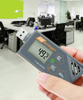 Usb Temperature Data Logger With Real Time Humidity And Barometric Pressure Monitoring Ip65 Waterproof Outdoor Tracker For Crisp Pdf Csv Reports No Hassle Plug And Play held in hand in modern office setting.