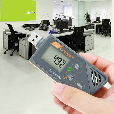Usb Temperature Data Logger With Real Time Humidity And Barometric Pressure Monitoring Ip65 Waterproof Outdoor Tracker For Crisp Pdf Csv Reports No Hassle Plug And Play held in hand in modern office setting.