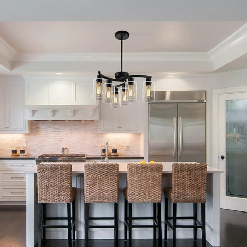 6 Light Modern Farmhouse Black Chandelier For Dining Room displayed over kitchen island with clear glass shades