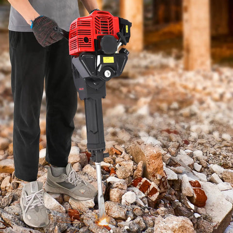 Gas Powered Demolition Jack Hammer 52cc 2 Stroke With Pointed And Flat Chisels, Heavy Duty Concrete Breaker in action on rubble