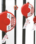 65560 Hinged Gate Valve Lockout Red for 1 to 2.5 inch valve handles in industrial settings with lockout tagout signs on pipes