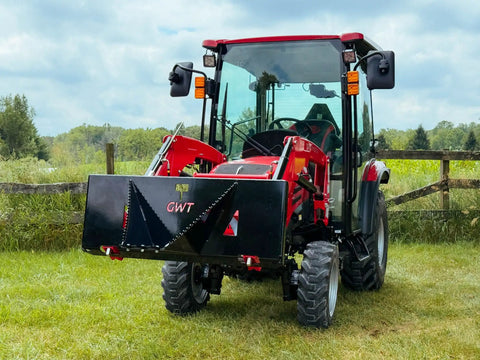 Beefy Stump Bucket For Tractors 32 To 60 HP Front End Loader Attachment on red compact tractor in field