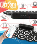9 Pad Portable Roll Up Drum Kit With USB MIDI Bluetooth showing Bluetooth connection feature and controls, hand holding phone