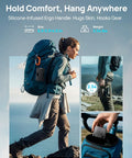 Woman hiking with Portable Power Station 89.6Wh LiFePO4 Battery With Solar Ready attached to backpack, showcasing handle.