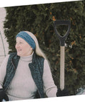 Person sitting with garden tool using Ergonomic Gardening Shovel Handle Replacement for Spade With Comfy Grip.