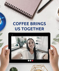 Person video calling on tablet near coffee cup, notebook, and plant with text 'Coffee Brings Us Together'