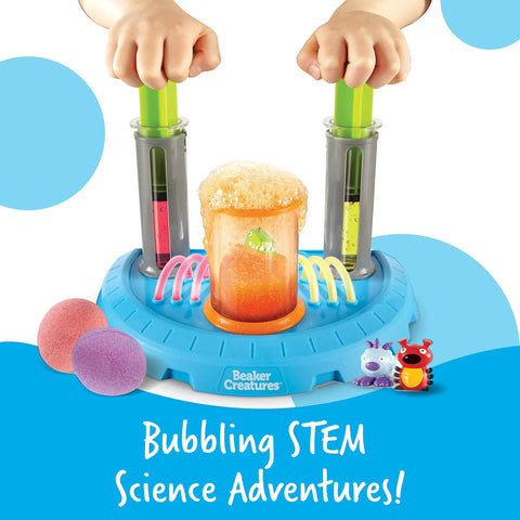 Hands operating Beaker Creatures Liquid Reactor Super Lab STEM Toy Kit with bubbling center and hydroplungers for experiments.
