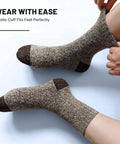 Five Pairs Merino Wool Socks for Men Ultra Thick Thermal Hiking Socks being worn, showcasing elastic cuff on leg.