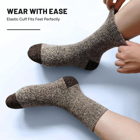 Five Pairs Merino Wool Socks for Men Ultra Thick Thermal Hiking Socks being worn, showcasing elastic cuff on leg.