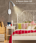 LED Wall Mount Bedside Reading Light With USB Output next to a bed with decorative pillows and a white headboard