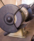 Close-up of a two-pack bench grinder with installed arbor washer flange set, pro grade carbon steel, visible grinding wheels