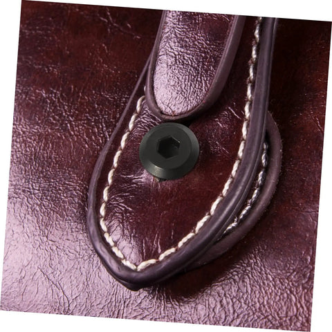 M6x25 Black Stainless Steel Binding Screws With Hex Socket Barrel Nuts For Rock Solid Furniture Assembly And Scrapbook Craft Hardware detailing on brown leather.