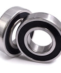 Top Shelf C3 Spindle Bearing Set Packed With High Heat Synthetic Grease For Cub Cadet Troy Bilt MTD Garden Tractors Smooth Operator Steering Axles, showing two metallic bearings.