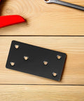 Stainless Steel Corner Brace Plates Set For Wood Shelves with black finish displayed on wooden surface