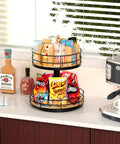 Two-Tier Lazy Susan Snack Organizer with grab-and-go design, wood and metal holder on kitchen counter, filled with snacks