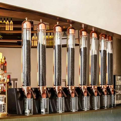 Wall Mounted Coffee Bean Dispenser With Slick Glass Tube And Rugged Steel Base, features multiple glass tubes for easy access.