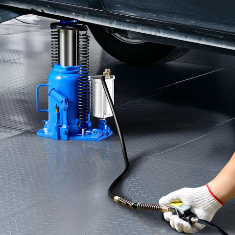 Air hydraulic bottle jack, 32-ton, blue with hand pump and coiled hose under a car.