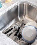Stainless Steel Sink Protector Grid 12 X 10.25 Inch rust-resistant non-slip rack with kitchen dishes and utensils in sink