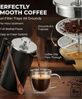 Double Wall Stainless Steel French Press Coffee Maker With Built In Thermometer And Fine Mesh Dual Filters pouring coffee into a glass cup.