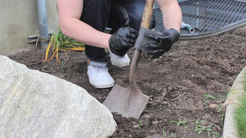Person applying Permanent Waterproof Repair Tape 100 Times Stronger Than Duct Tape, 2 Inch Wide Roll on a shovel handle.