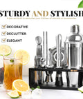 Ultimate Home Bar Mixology Kit With Stand 15 Piece Silver Bar Tool Set for Crafting Dope Cocktails at Home on display with drinks
