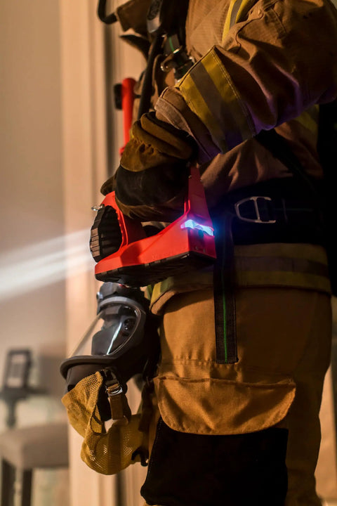 Firefighter holding Vulcan 180 Lantern Cranks Out 1200 Lumens With 548M Beam, 180-Degree Articulating Head That Locks Forward