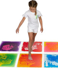Child walking on Interactive 20 Inch Liquid Floor Tiles Set In Six Colors No Setup Non Slip Pressure Tested Non Toxic Sensory Floor Tiles.