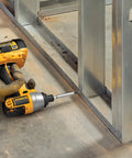 Pro Grade 3 Inch Magnetic Bit Tip Holder Set in use with power drill on metal frame, showcasing steel construction and strong magnetic retention.