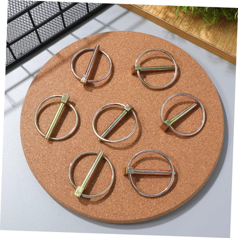 Heavy Duty Lynch Pin Assortment Kit, 10-Piece Set, 3/16 Inch Locking Clips For Farm Tractors, Trailers, And Lawn Mowers, Smooth Edges For Safe Handling, Secure Lock, Prevents Accidental Disengagement, Durable Steel Pins displayed on cork board