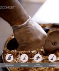 Hand using Top Shelf Clear Vinyl Disposable Gloves Straight Up Reliable 3 Mil Thickness to cut pizza in food processing.