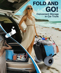 Beach Cart For Sand Foldable Aluminum Wagon With Balloon Wheels and 13 Inch Wide Tires, shown by the beach with woman and car trunk