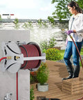 Solid Build Stainless Steel Hose Cart With Multi Mode Spray Nozzle to enables efficient outdoor cleaning on a wooden deck.