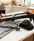 Adjustable Stainless Steel Mandoline Slicer For Kitchen Vegetables With 7 In 1 Blades, gloves, pusher, brush, on kitchen counter