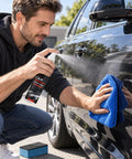 Man using Two Pack Universal Car Scratch Repair Spray on a black car door while buffing with a blue microfiber cloth.