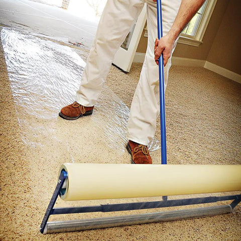 Applying Heavy Duty Carpet Shield Film 36 Inch By 500 Feet 2 Mil Tear Resistant Masking Film to carpet with roller applicator