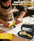 Mulctun Cordless Electric Box Cutter With 4 Tungsten Steel Blades, Led Light And Safety Lock For Cutting Cardboard, Carpet, Fabric, And Leather. Heavy Duty Portable Design With Storage Bag. Yellow Finish, shown in use on fabric.