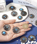 Hand holding assorted Badass Vintage Turquoise Screw Back Concho Kit for Leather Work and Fabric Sewing 22 Assorted Styles.