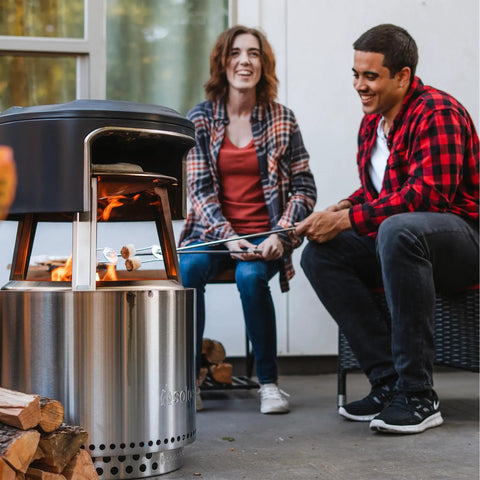 Bonfire Pi Fire Pizza Oven Accessory For Fire Pit With Cordierite Pizza Stone And Carry Case in use outdoors
